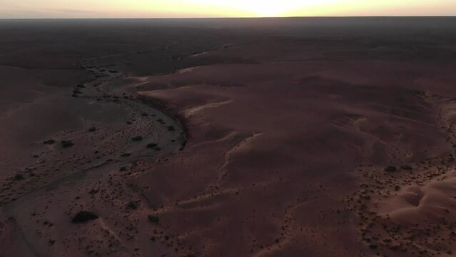 Beauty of nature of Moroccan Erfoud desert and red terrain. Aerial drone view over martian landscape