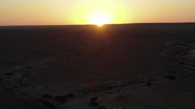 Sunset over Morocco Erfoud desert in the Saharan Dr&acirc;a-Tafilalet region. Aerial flyover