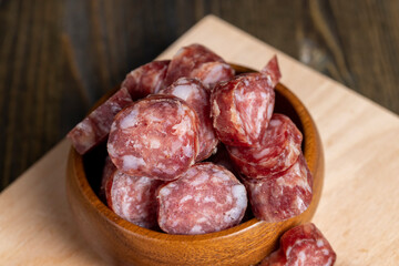 Cut the finished sausage into pieces on a cutting board