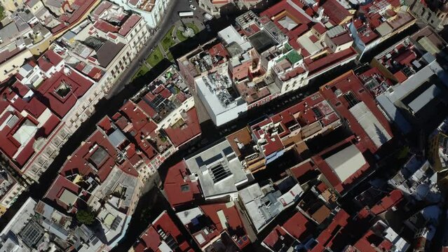 Drone captures aerial footage of Mexico City, the most populous city in North America, with several large buildings, clean roads, and popular landmarks.
