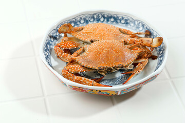 Steamed Blue Crab Served on Chinese Ceramic Plate on White Background, Food Preparation.
