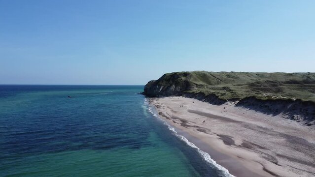 the well-known cliffs of bulbjerg on the North Sea in Denmark, with breathtakingly beautiful weather and fine white sandy beach