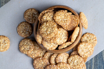 oatmeal thin round cookies with lots of sesame seeds