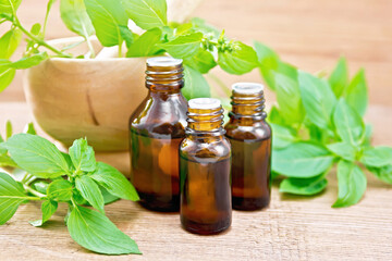 Oil with basil and mortar on board