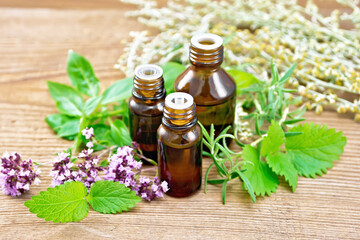 Oil with herbs and wormwood on wooden board