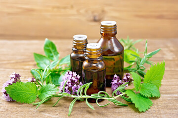 Oil with herbs on wooden board