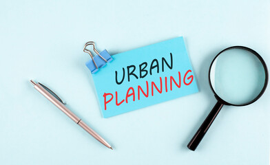 URBAN PLANNING text written on sticky with magnifier and pen, business concept
