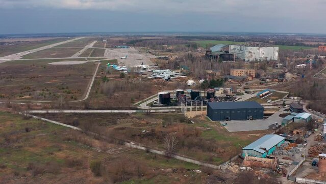 Top view of the airport in Gostomel. Burnt planes and fuel tanks. Russian war crime.