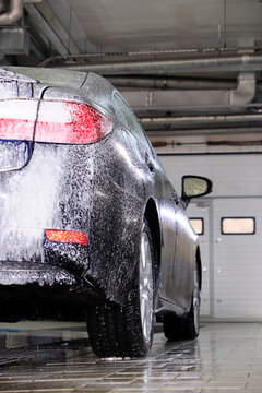 Cleaning Dark Blue Car At The Car Wash