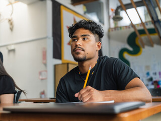 Obraz premium Left side portrait of a Native student looking up during class