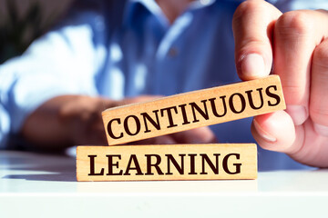 Wooden blocks with words 'Continuous Learning'.