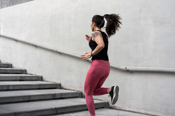 Young woman running fast on the ladder