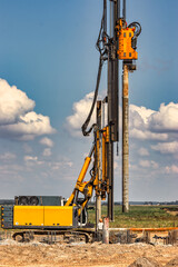 Powerful hydraulic drilling rig at a construction site. The device of pile foundations. Bored piles. Heavy construction equipment.