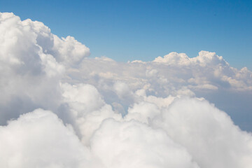 Naklejka na ściany i meble Blue sky and clouds background, high angle view