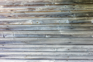 Old wooden wall of pine boards close up