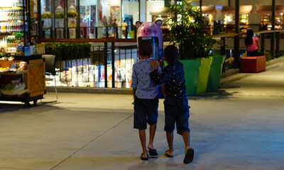two Asian boy  at the  shop