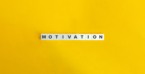 Motivation Word on Block Letter Tiles on Yellow Background. Minimal Aesthetics.