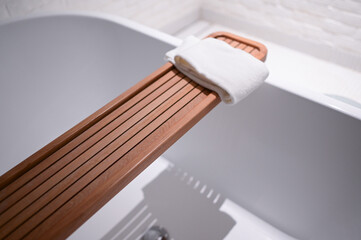 white towels put on bathtub in the bathroom