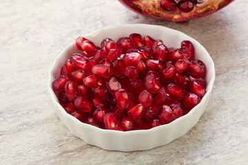 Ripe red Pomegranate seeds in the bowl