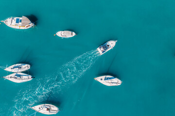 Top view from drone of sailboats and various speed boats. Aerial view of luxure yachts and...