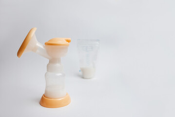 Background of automatic breast pump, baby bottle for milk. Mother's breast milk is the healthiest food for a newborn