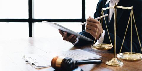 Law and Legal services concept, Good service cooperation, lawyer hands using tablet and working on...