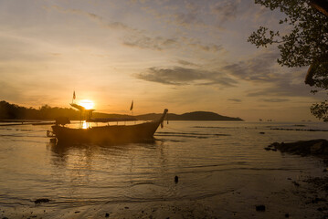 Sunrise over Andaman Sea with high tide, South of Thailand, sunset at the beach