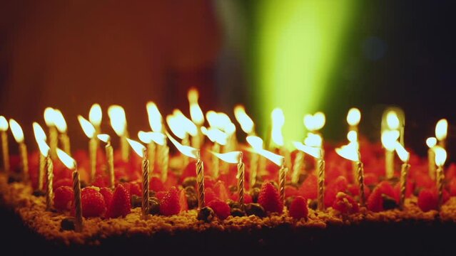 Candles in a birthday cake in slow motion