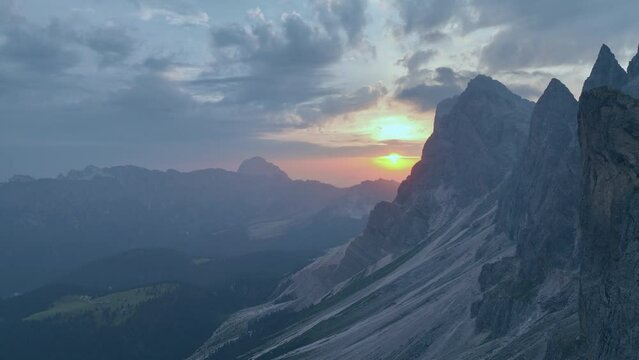 View from above, stunning aerial view of the mountain range of Seceda during a beautiful sunrise. The Seceda with its 2.500 meters is the highest vantage point in Val Gardena, Dolomites, Italy
