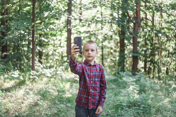 photo boy with a mobile phone in various poses, the concept of modern life