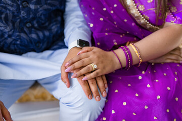 Obraz na płótnie Canvas Indian couple's holding hands close up