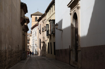 Walking in old central part of world heritage city Granada, Andalusia, Spain