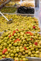 Assortment of pickled green olives on farmers market in Malaga, Andalusia, Spain