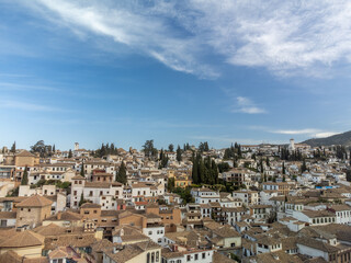 Aerial panoramic view on buildings, old district, mountains and palace, world heritage city Granada, Andalusia, Spain