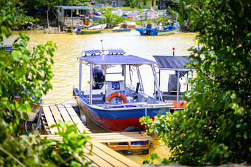 Fototapeta na wymiar Fishing boats with nobody in Terengganu, Malaysia.