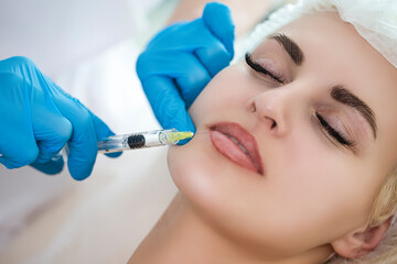 Plastic Surgery Concepts. Closeup Beautician Hands Doing Facial Skin Lifting Injection To Woman's...