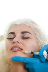 Cosmetologist Accomplishing Injections for Lips Augmentation and Anti Wrinkle in the Nasolabial Folds of a Caucasian Female Woman While in Beauty Salon