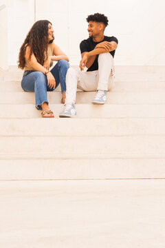 Smiling Couple Talking On Steps