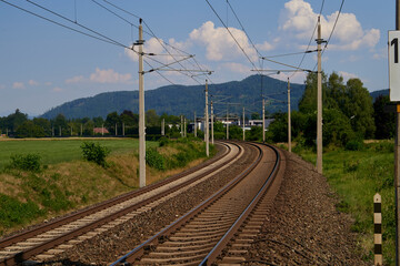 Fototapeta na wymiar Landscape with railroad, blue sky in summer. Transportation