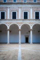 Urbino, detail of the internal courtyard of the ducal palace.