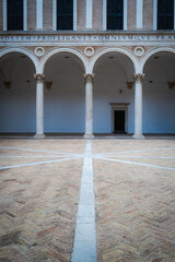 Urbino, detail of the internal courtyard of the ducal palace.