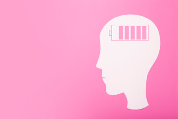 Brain charge concept. Brain energy charging indicator on paper-cut head. mental health idea