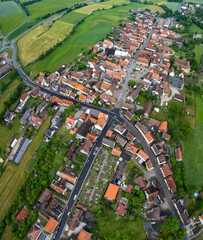 Aerial view of the village Neuhof an der Zenn in Germany, Bavaria on a sunny summer day. 