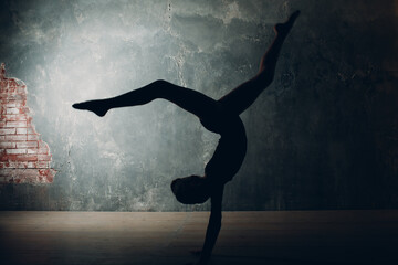 Young girl professional gymnast woman dance rhythmic gymnastics at studio.