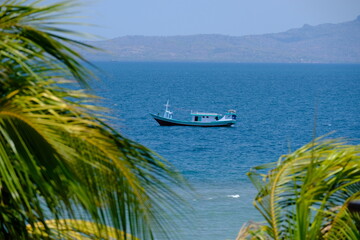 Indonesia Kupang - Coastline  seascape with traditional fishing boat lie at anchor