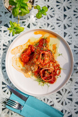 Baked chicken with tomatoes and herbs sauce