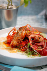 Baked chicken with tomatoes and herbs sauce