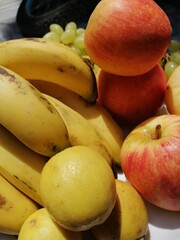apples, bananas, graps and lemons 