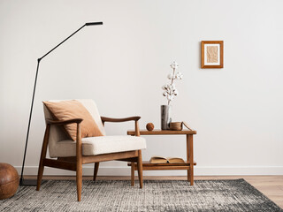 Minimalist composition of elegant living room space with white boucle armchair, photos mock up...