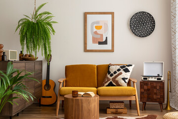 Vintage and cozy space of dining room with mock up poster frame, yellow sofa, wooden coffee table, guitar, plants, commode, decoration and personal accessories. Stylish home decor. Template. 